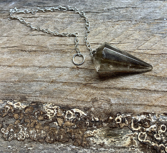 1 1/4 inch smoky quartz crystal point pendulum including a silver 8 inch chain