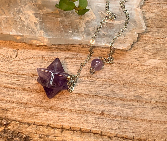 3/4 inch amethyst merkaba pendulum attatched to an 8 inch silver chain 