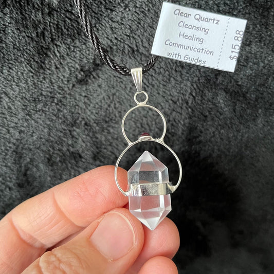 Clear quartz double point crystal, secured beautifully by thesilver semicircles suspended from an adjustable black cord.