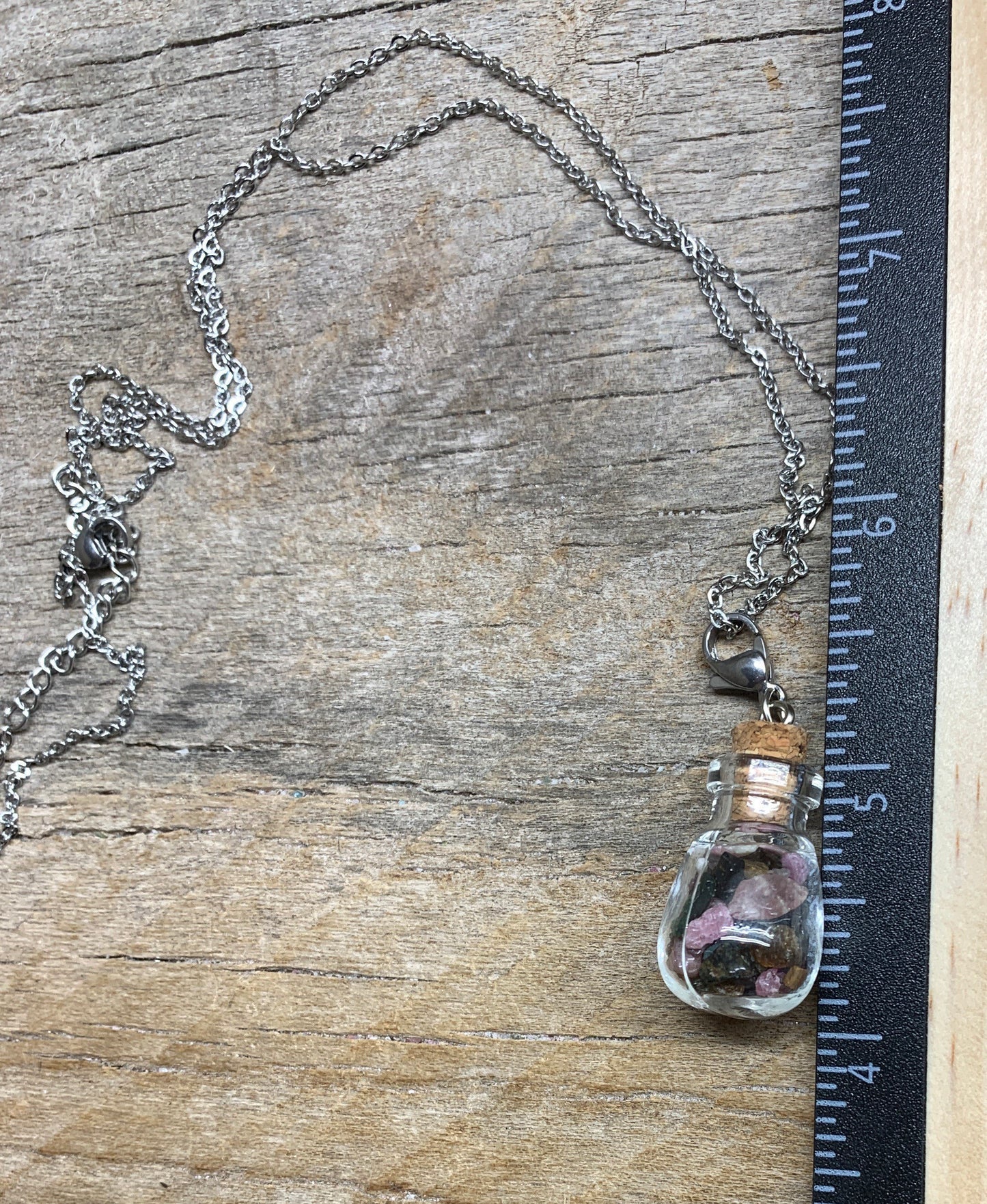 Tourmaline Necklace in Corked Round Bottle. 24” chain. 1147