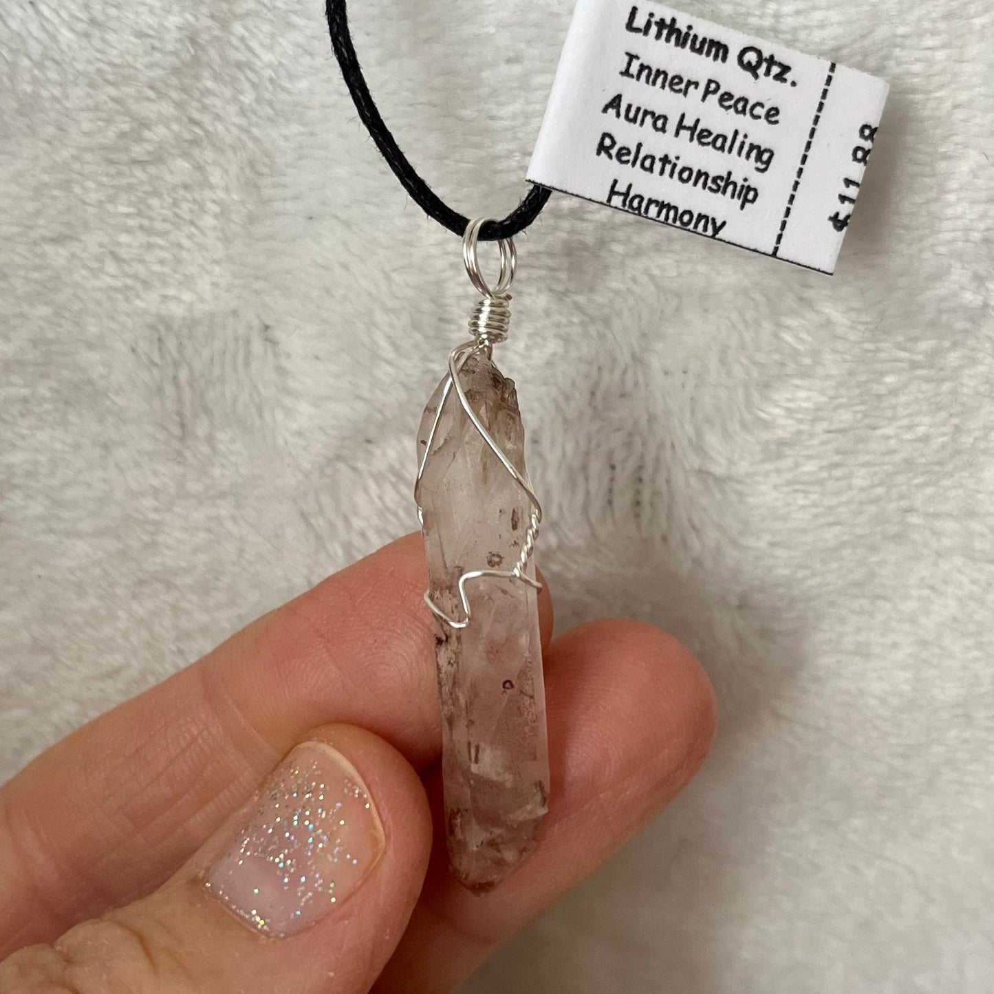 Silver wire wrapped lithoum quartz crystal pendant, a brilliant mix of both from red and clear, approximately 1 1/4" long