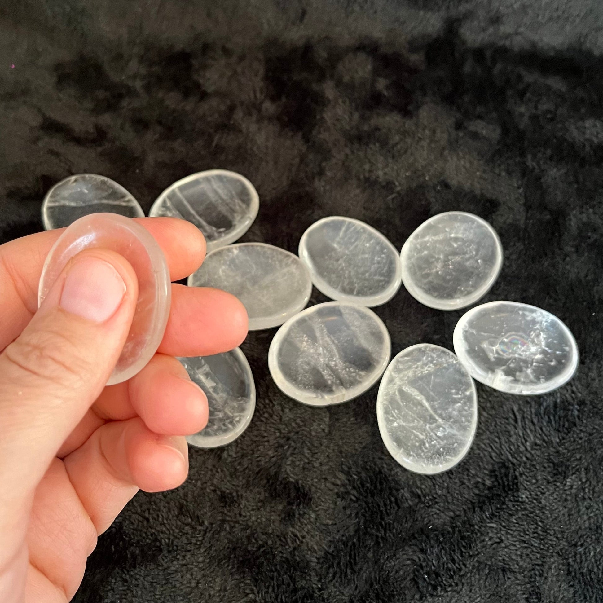 Smooth, translucent quartz worry stones – perfect for calming anxiety and promoting relaxation through tactile sensation.