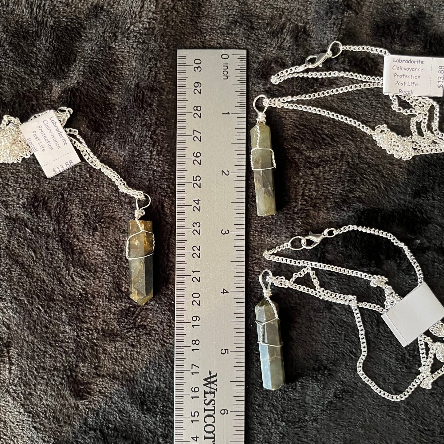 3 Silver Wire Wrapped Labradorite Point Pendant attatched to silver chains.  Stones are approximately 1 1/4" - 1 1/2" long, displayed next ro a ruler.