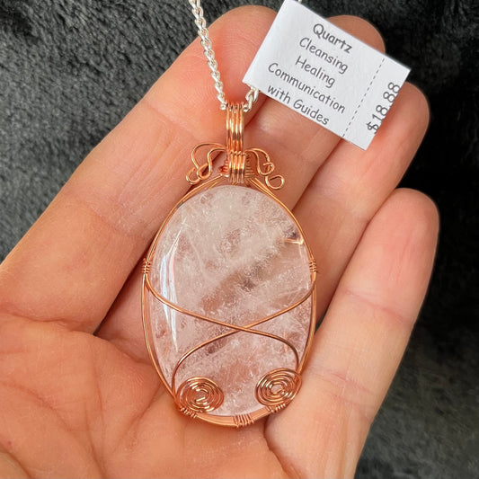  Fancy copper wire wrapped clear quartz oval stone pendant attatched to a silver chain